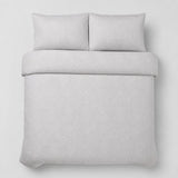 Overhead flat lay of the Embossed Geo Microfibre Duvet Cover Set in grey with two matching pillowcases