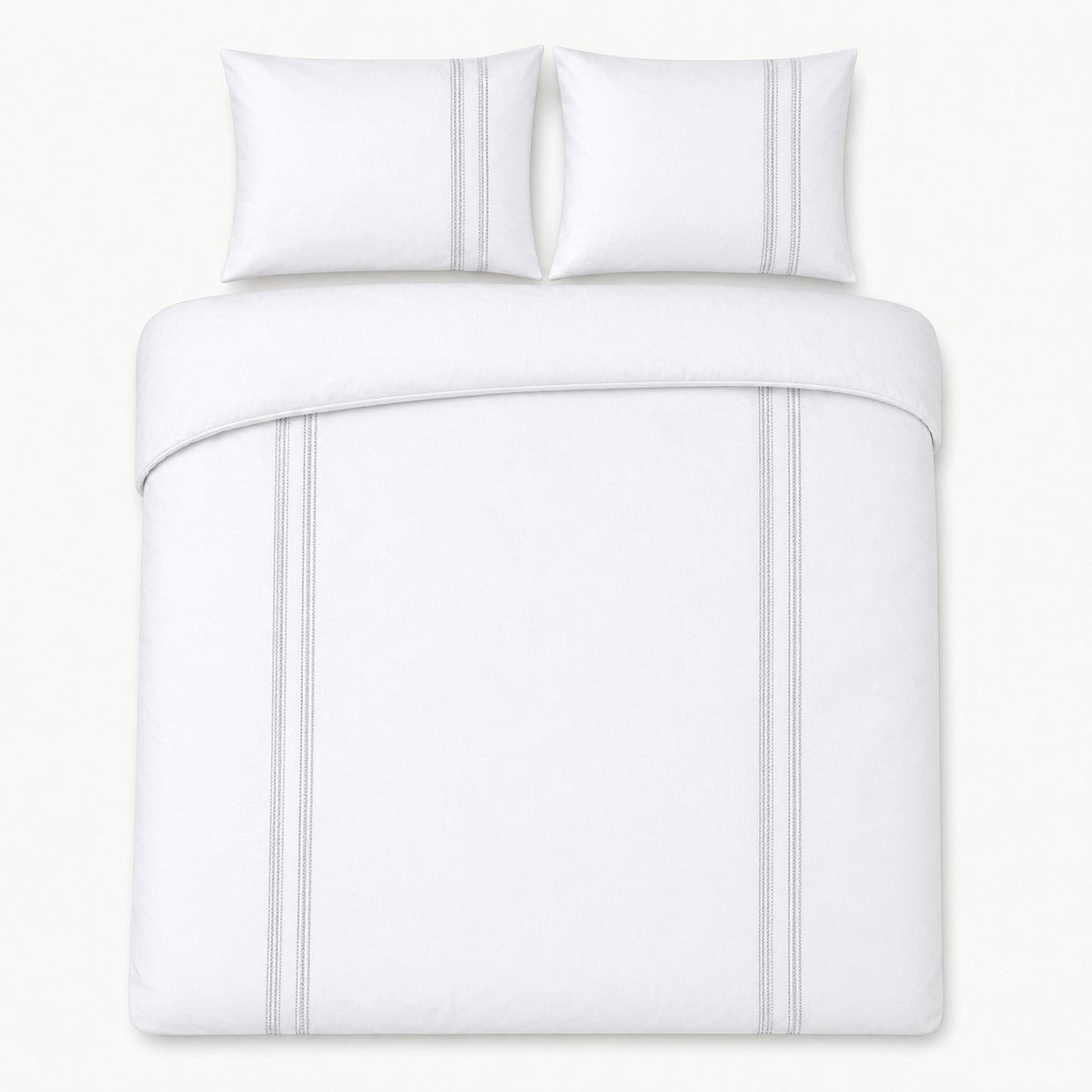 Overhead flat lay of the Embroidered Band silver cotton duvet cover set with two pillows