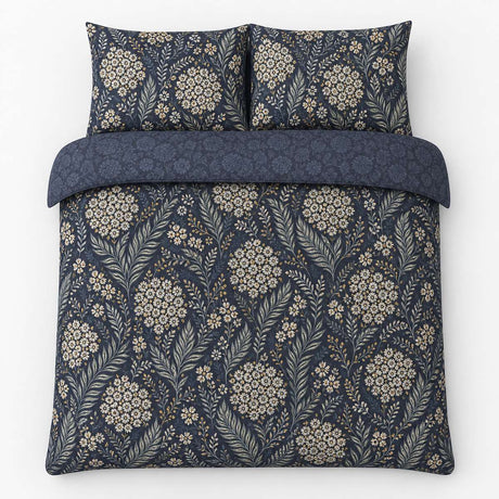 Overhead flat lay of the Evelina Floral Cotton Duvet Cover Set with two matching pillowcases