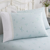Close-up of Fifi duck egg botanical pillowcases showing the delicate print and lace trim