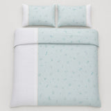 Overhead flat lay of the Fifi duck egg botanical duvet cover set with two matching pillows