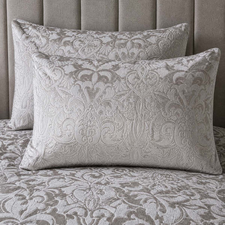 Close-up of Firenza Silver velvet jacquard pillowcases showing the raised damask pattern