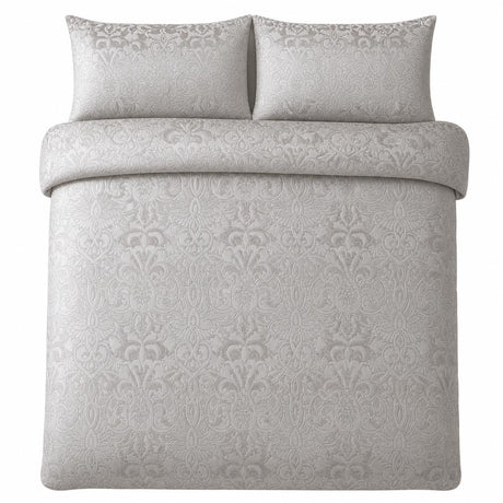 Overhead flat lay of the Firenza Silver velvet jacquard duvet cover set with two pillows
