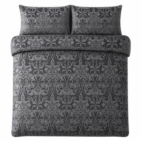 Overhead flat lay of the Firenza Slate velvet jacquard duvet cover set with two pillows