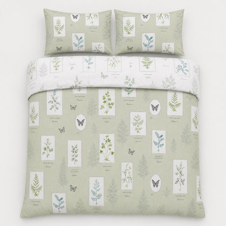 Overhead flat lay of the Floral Garden green reversible duvet cover set with two pillows