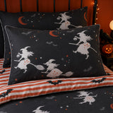 Close-up of Flying Witches Halloween pillowcases with witch moon and striped reverse design