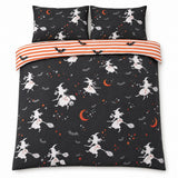 Overhead flat lay of the Flying Witches Halloween duvet cover set with orange striped reverse