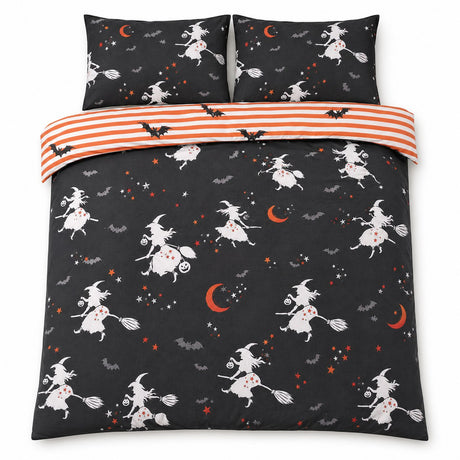Overhead flat lay of the Flying Witches Halloween duvet cover set with orange striped reverse