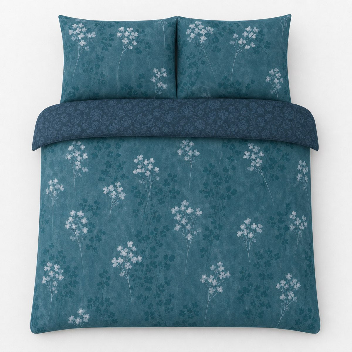Overhead flat lay of the Flynn Eco Floral Teal Polycotton Duvet Cover Set with two matching pillowcases