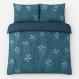 Overhead flat lay of the Flynn Eco Floral Teal Polycotton Duvet Cover Set with two matching pillowcases