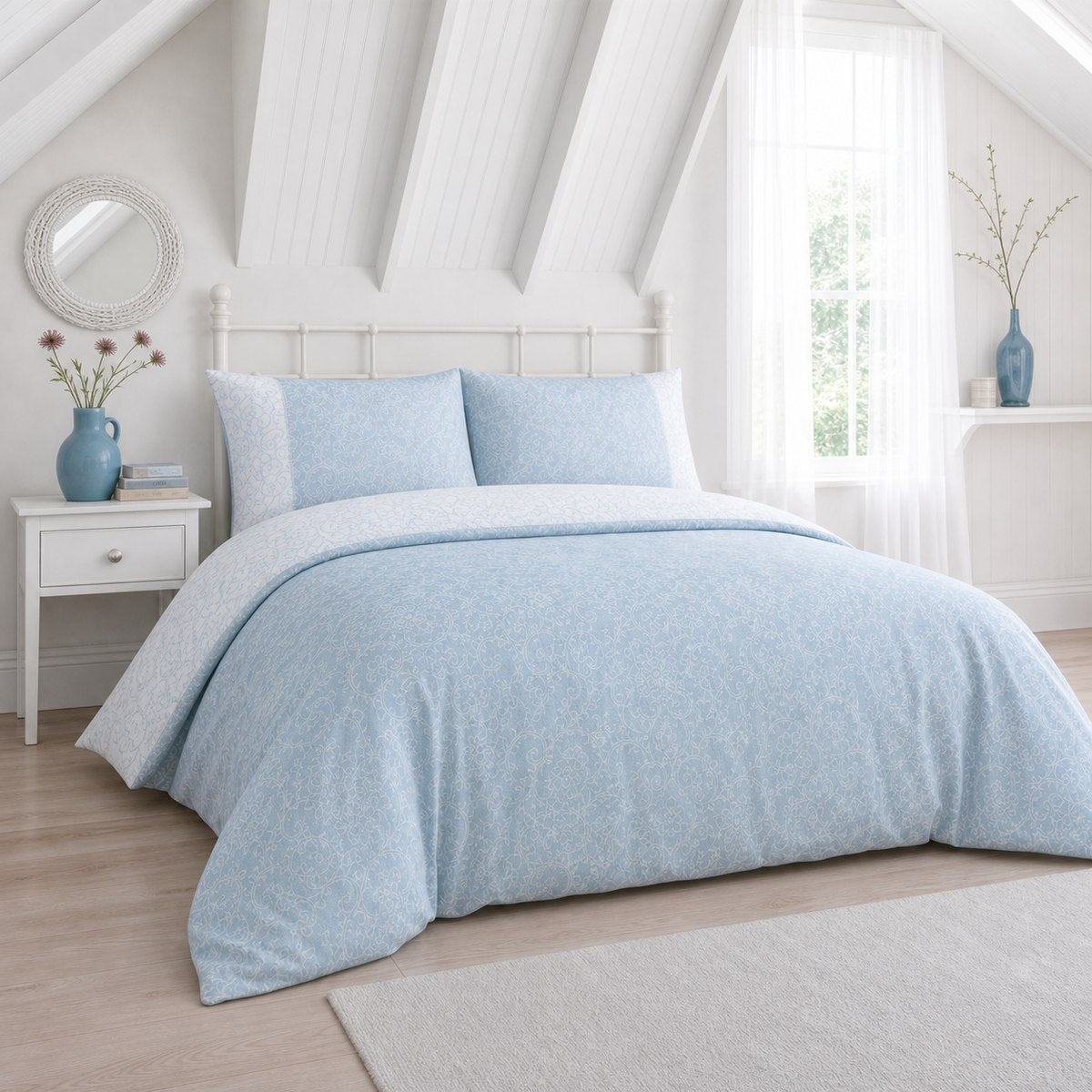 Frampton Floral Polycotton Duvet Cover Set in blue styled on a coordinated bedroom bed