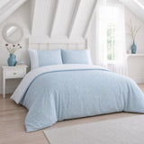 Frampton Floral Polycotton Duvet Cover Set in blue styled on a coordinated bedroom bed