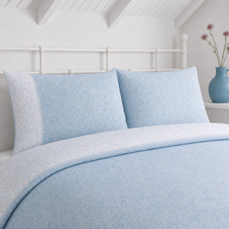 Close-up of Frampton Floral Polycotton Duvet Cover Set in blue pillowcases showing the print and fabric detail