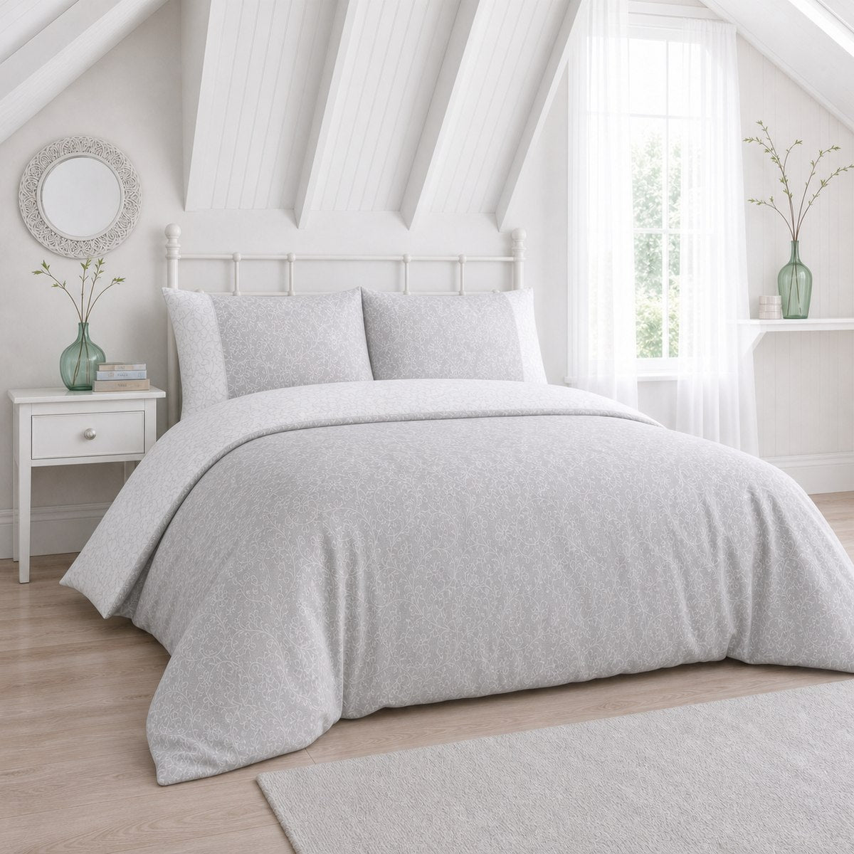 Frampton Floral Polycotton Duvet Cover Set in grey styled on a coordinated bedroom bed
