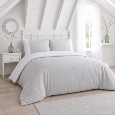Frampton Floral Polycotton Duvet Cover Set in grey styled on a coordinated bedroom bed
