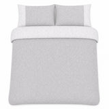 Overhead flat lay of the Frampton Floral Polycotton Duvet Cover Set in grey with two matching pillowcases