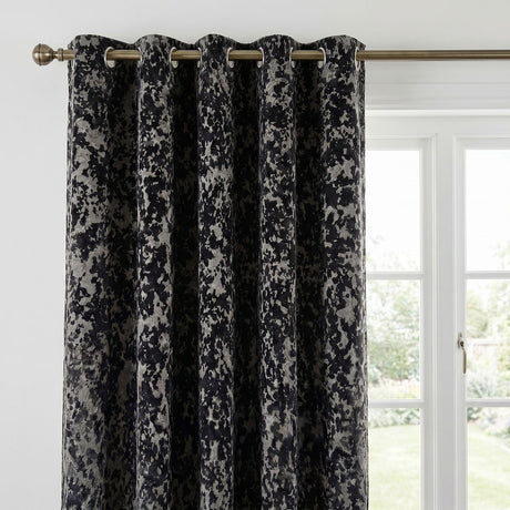 Close-up of the black Galaxy room darkening eyelet curtain showing the textured fabric and eyelet heading