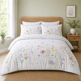 Gardenia white floral cotton duvet cover set styled on a soft airy bedroom bed