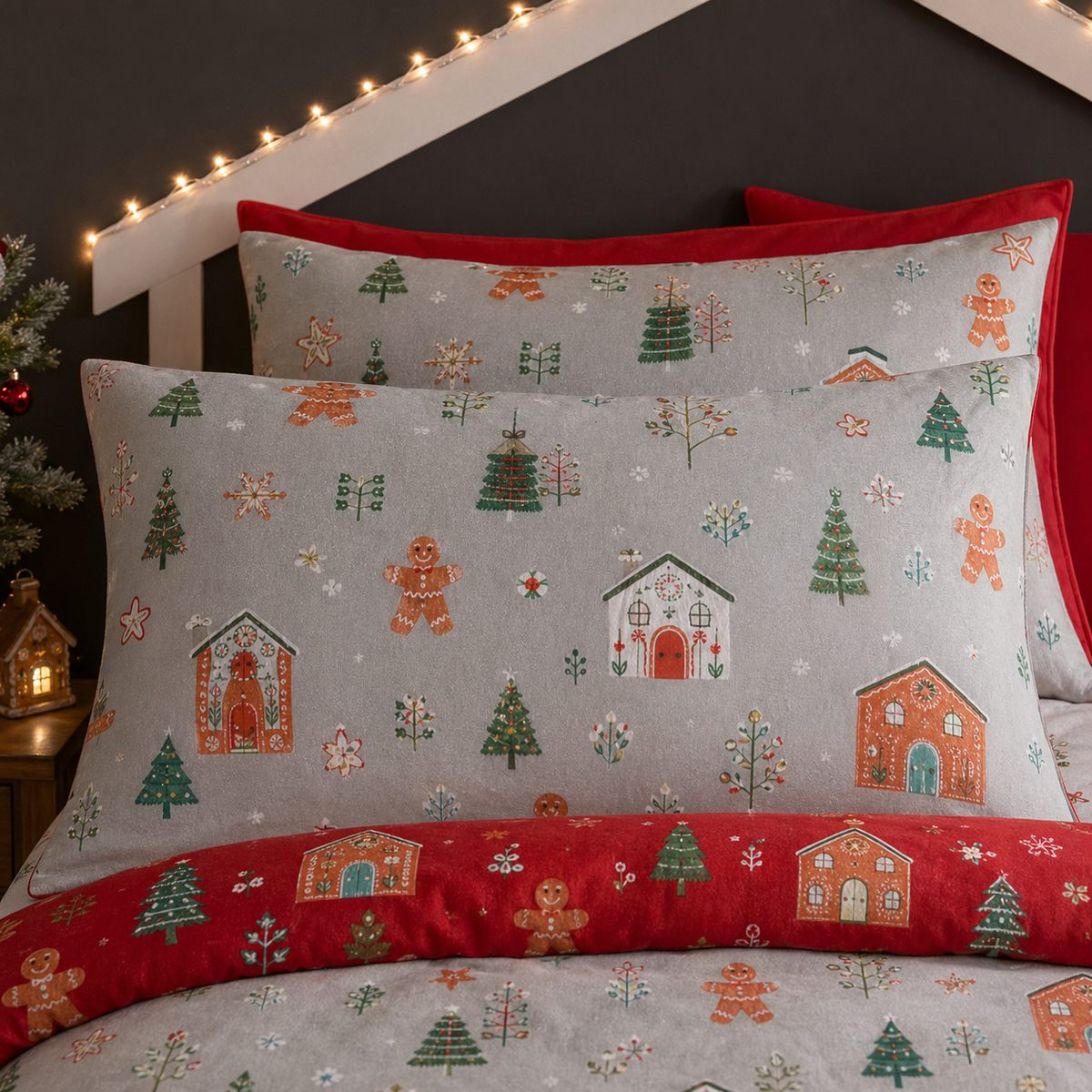 Close-up of matching Gingerbread House Christmas Polycotton Duvet Cover Set pillowcases showing the pattern and fabric detail