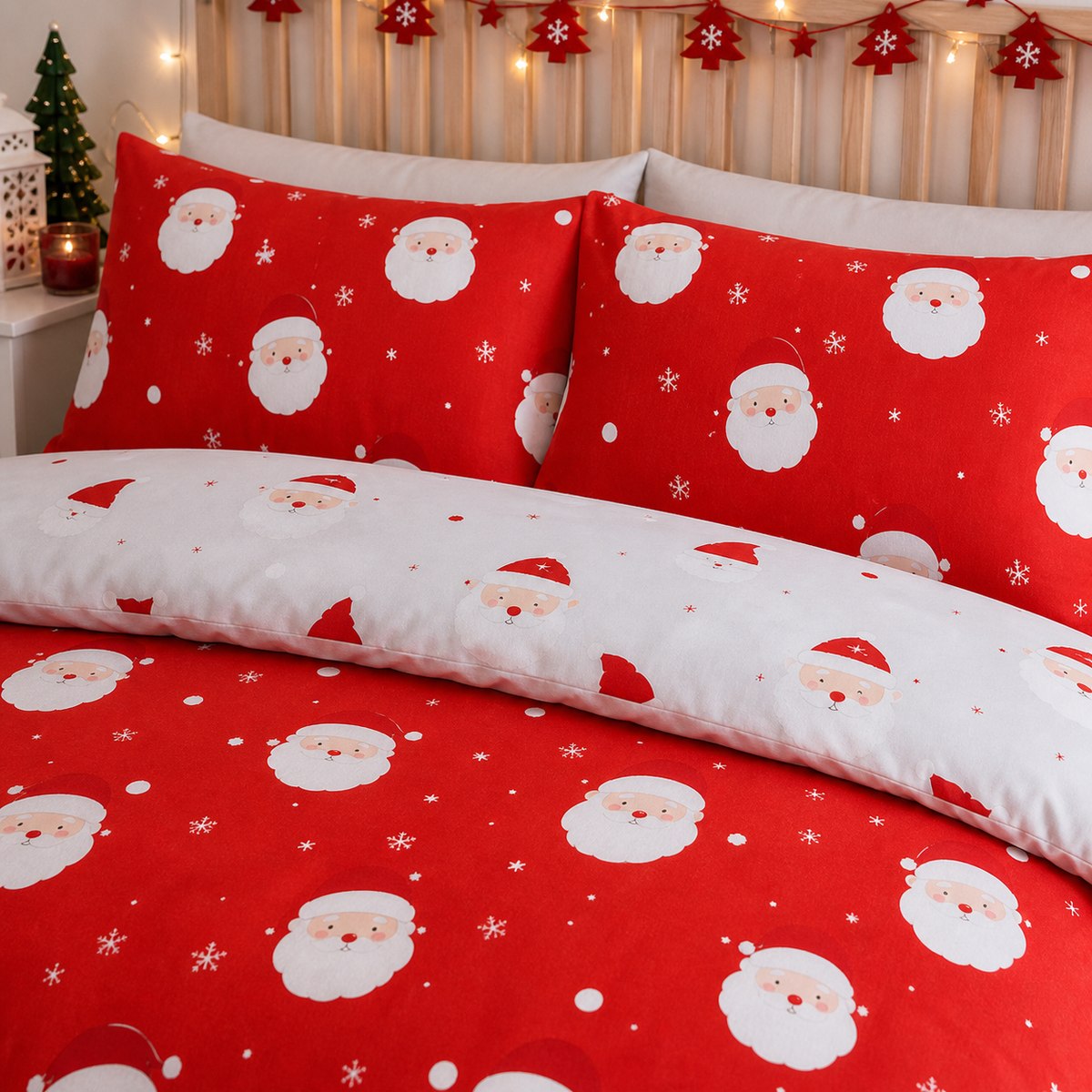 Close-up of matching Happy Santa Christmas Microfibre Duvet Cover Set pillowcases showing the pattern and fabric detail