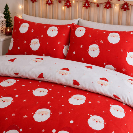 Close-up of matching Happy Santa Christmas Microfibre Duvet Cover Set pillowcases showing the pattern and fabric detail