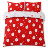 Overhead flat lay of the Happy Santa Christmas Microfibre Duvet Cover Set with two matching pillowcases