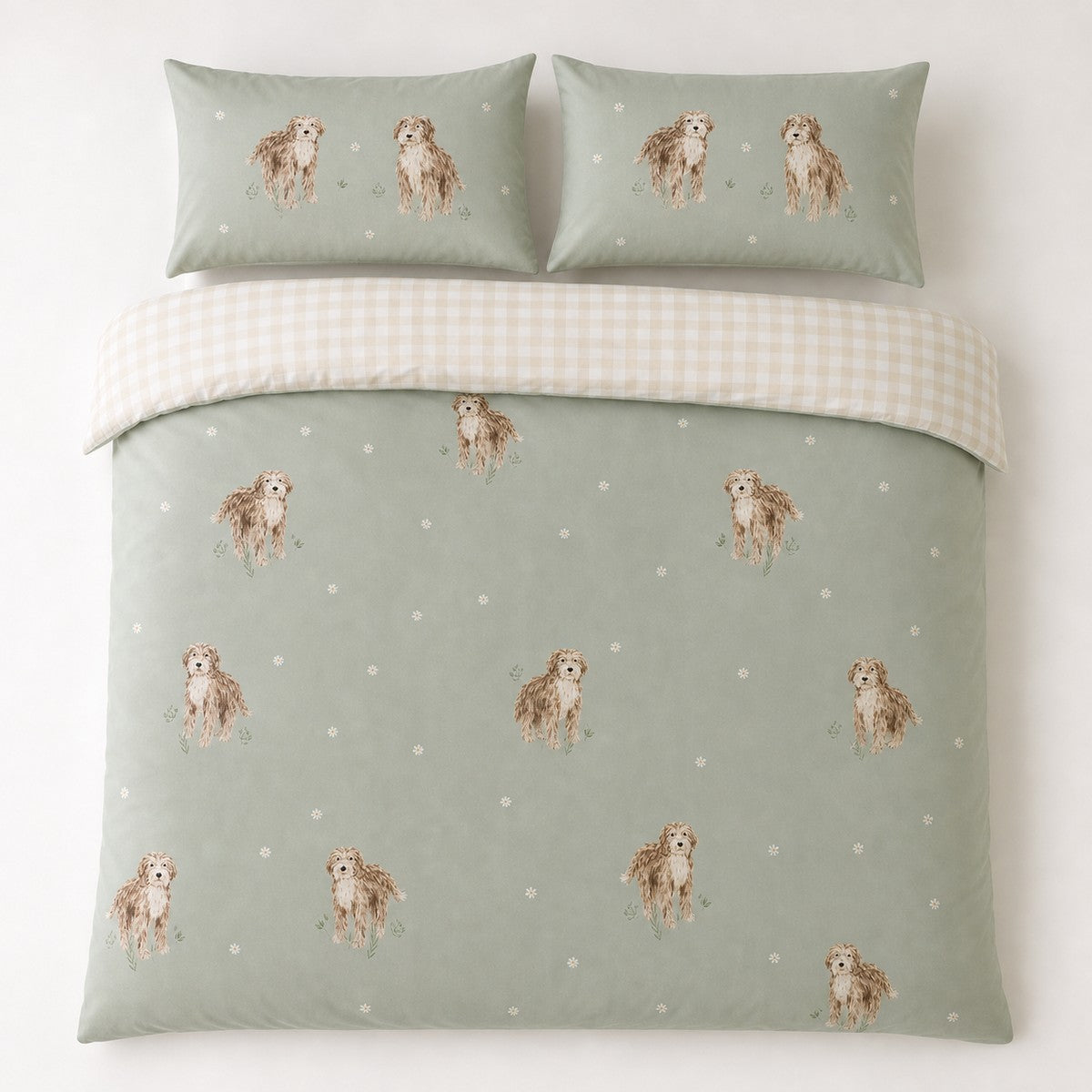 Overhead flat lay of the Hattie Cockapoo Dog Print Microfibre Duvet Cover Set in green with two matching pillowcases
