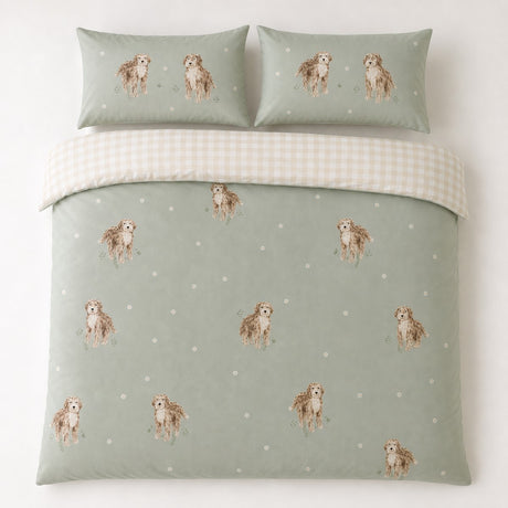 Overhead flat lay of the Hattie Cockapoo Dog Print Microfibre Duvet Cover Set in green with two matching pillowcases