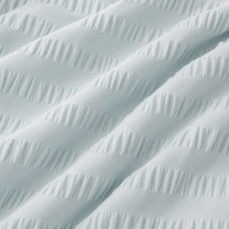 Macro close-up of Honley duck egg seersucker microfibre fabric with raised textured stripes