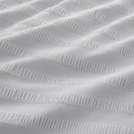 Macro close-up of Honley silver seersucker microfibre fabric with raised textured stripes