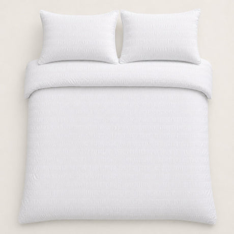 Overhead flat lay of the Honley white seersucker duvet cover set with two pillows