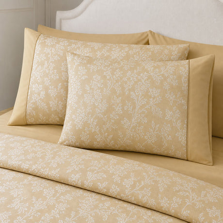Close-up of Jasmine champagne floral woven polycotton pillowcases showing the soft white vine pattern
