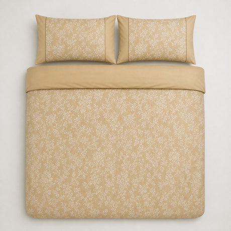 Overhead flat lay of the Jasmine champagne floral duvet cover set with two matching pillowcases