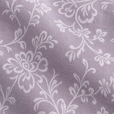 Macro close-up of the Jasmine lavender woven polycotton fabric with white floral vine detail