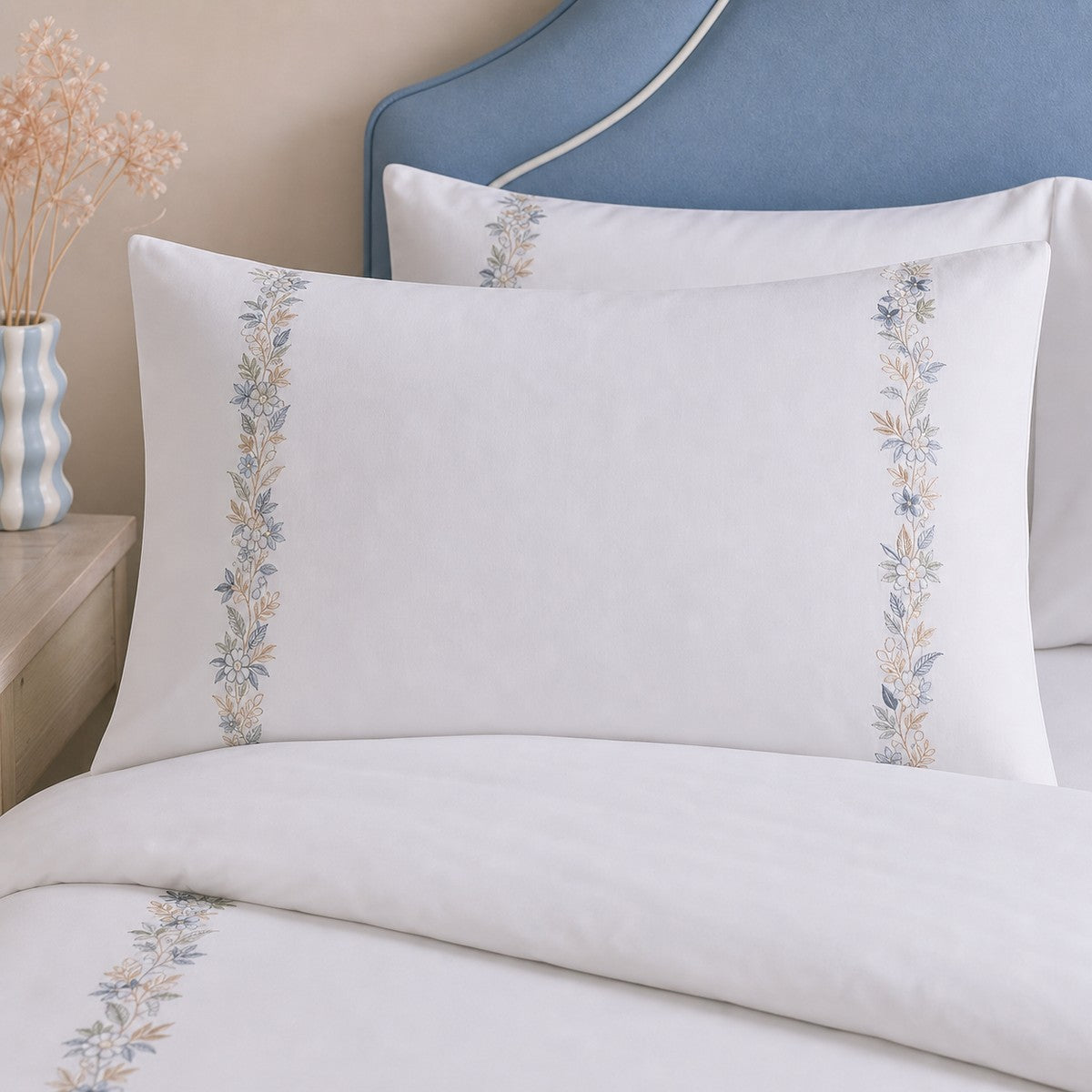 Close-up of Julianna Embroidered 100% Cotton Duvet Cover Set in white pillowcases showing the print and fabric detail