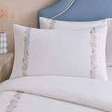 Close-up of Julianna Embroidered 100% Cotton Duvet Cover Set in white pillowcases showing the print and fabric detail