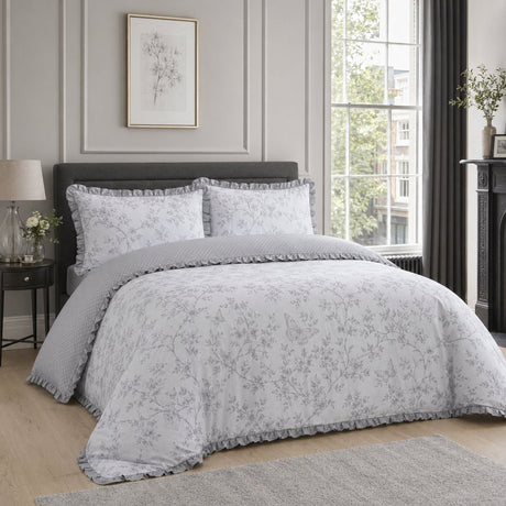 Kristen grey frill polycotton duvet cover set styled on an elegant bedroom bed