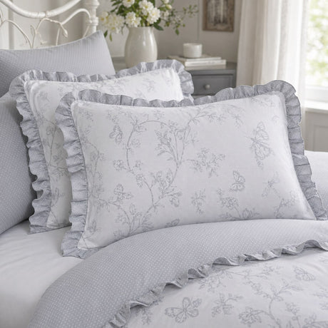 Close-up of Kristen grey frill pillowcases showing the floral print and ruffled edge