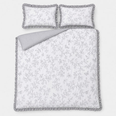 Overhead flat lay of the Kristen grey frill duvet cover set with two matching pillows