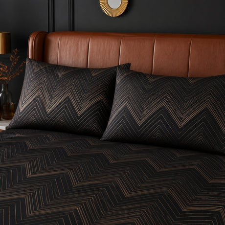 Close-up of Laurence Llewelyn-Bowen Cocktail Microfibre Duvet Cover Set in black pillowcases showing the print and fabric detail