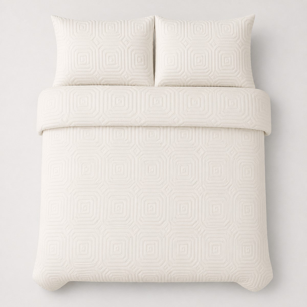 Overhead flat lay of the Laurence Llewelyn-Bowen Emile Microfibre Duvet Cover Set in cream with two matching pillowcases