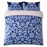 Overhead flat lay of the Laurence Llewelyn-Bowen Romilly Velvet Floral Duvet Cover Set with two matching pillowcases