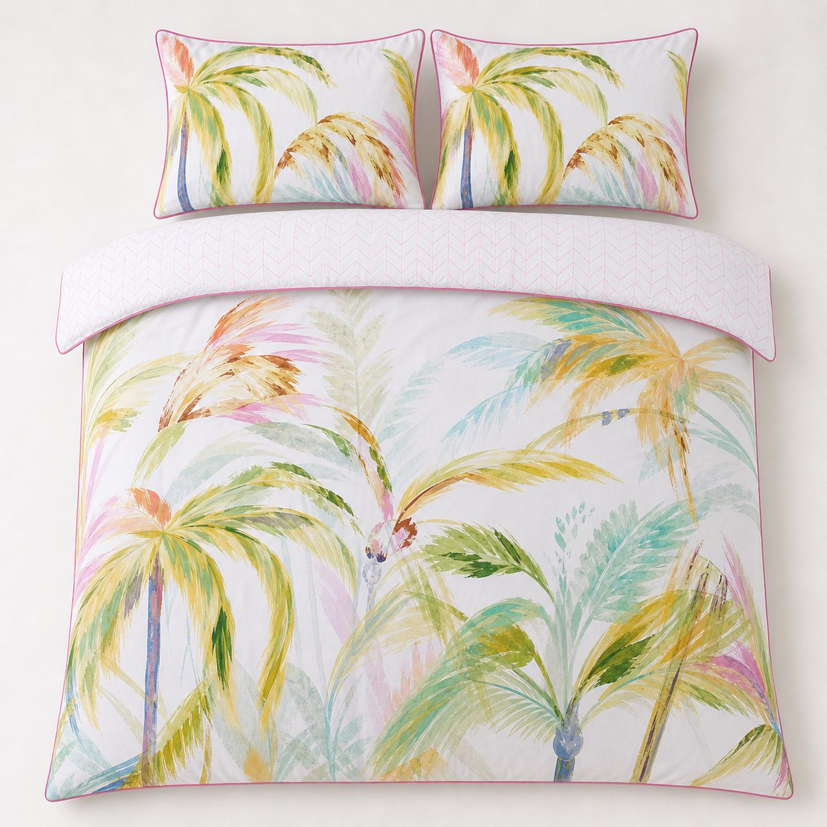Overhead flat lay of the Leilani Cotton Duvet Cover Set in green with two matching pillowcases