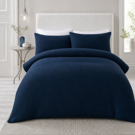 Lindly Waffle Microfibre Duvet Cover Set in navy styled on a coordinated bedroom bed