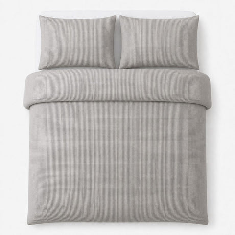 Overhead flat lay of the Lindly Waffle Microfibre Duvet Cover Set in silver with two matching pillowcases