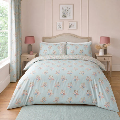 Lorena Patchwork Floral Duck Egg Polycotton Duvet Cover Set styled on a bed in a coordinated bedroom lifestyle scene