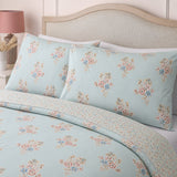Close-up of matching Lorena Patchwork Floral Duck Egg Polycotton Duvet Cover Set pillowcases showing the pattern and fabric detail