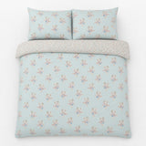 Overhead flat lay of the Lorena Patchwork Floral Duck Egg Polycotton Duvet Cover Set with two matching pillowcases