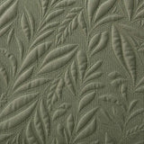 Macro close-up of the dark olive green Luana soft microfibre leaf stitch fabric