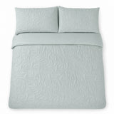 Overhead flat lay of the Luana Green duvet cover set with two matching pillowcases